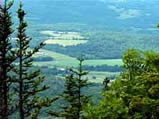 Mountaintop view of a valley. 